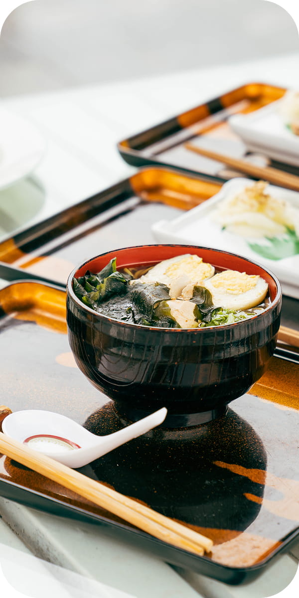 Japanese meal tray with miso soup and side dishes at Hokke Hotel