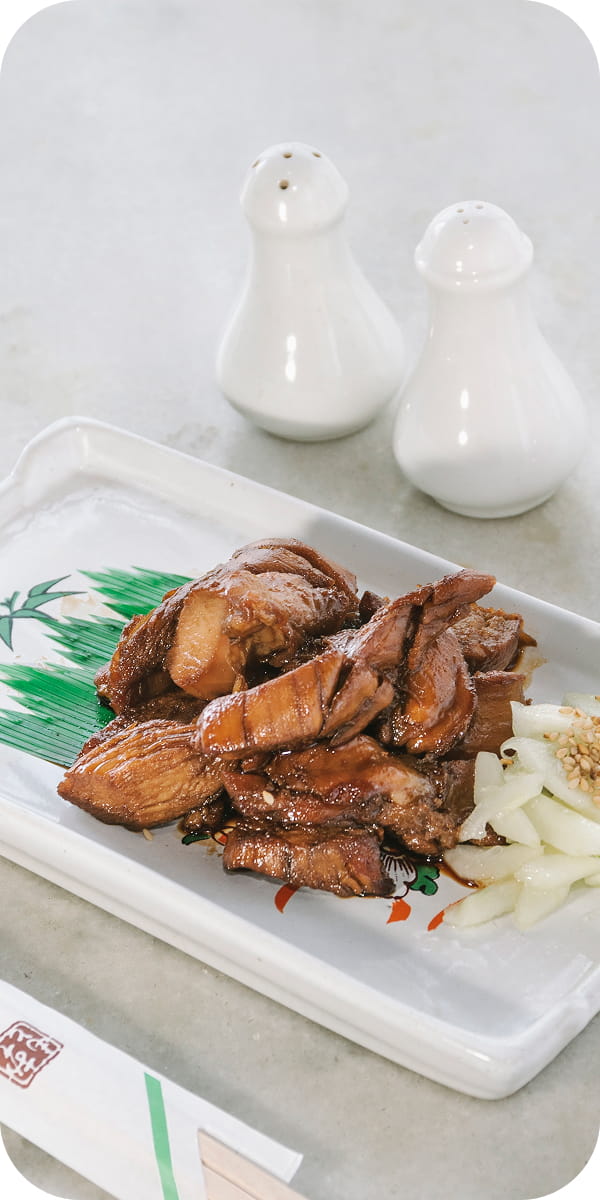 Grilled dish served on a white plate at Hokke Hotel's restaurant
