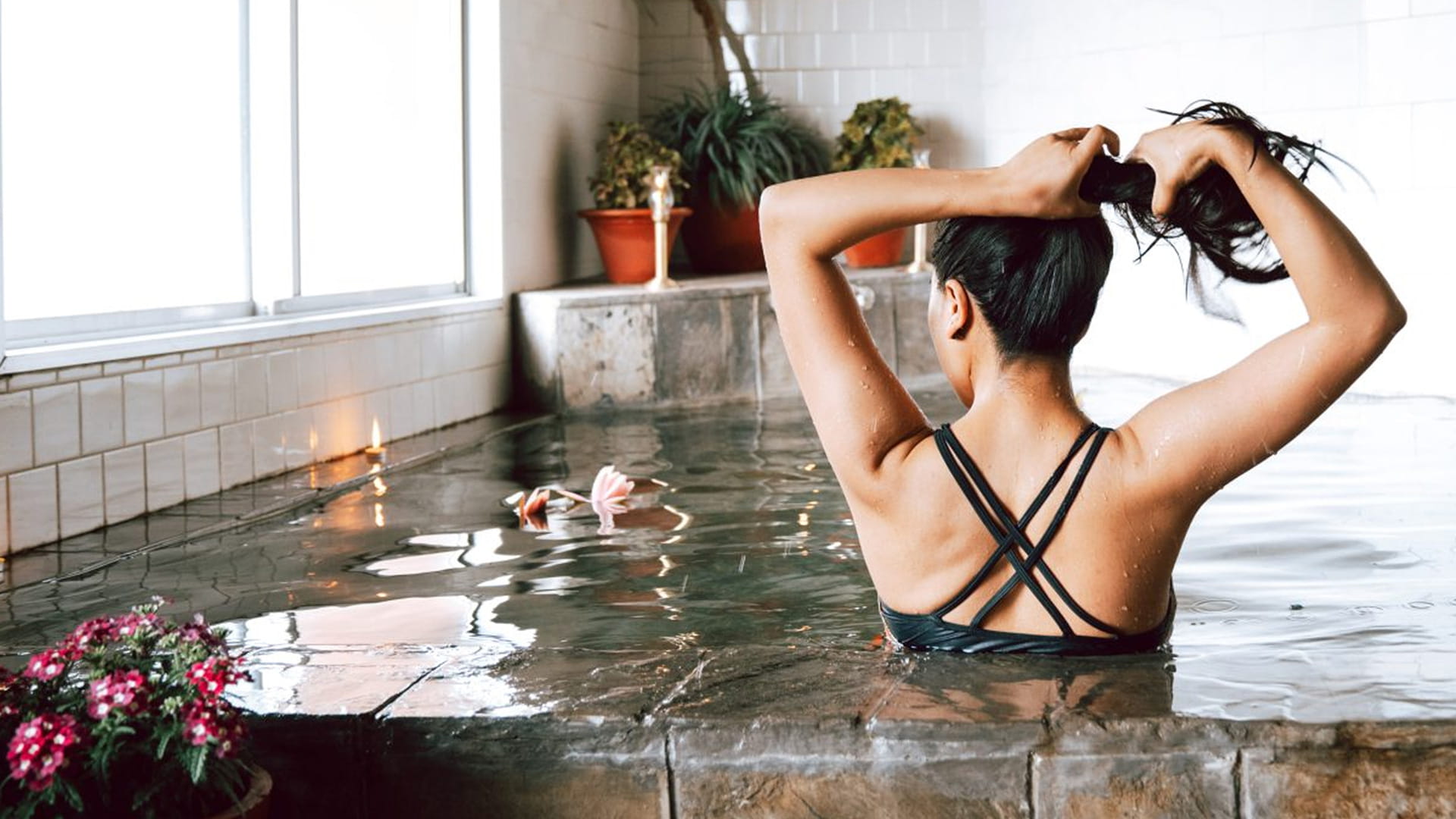 Guest relaxing in the warm Japanese bath at Hokke Hotel